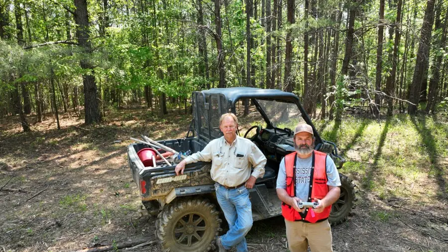 Eric Entrekin with a landowner after a pine thinning