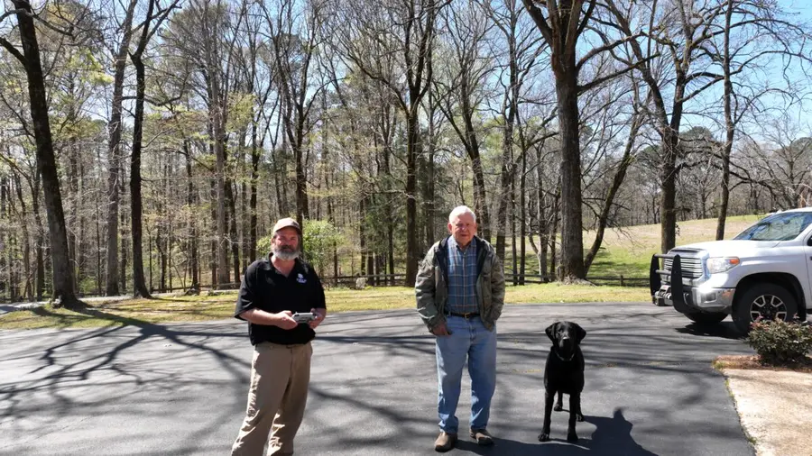 Eric Entrekin meeting a client and his Labrador